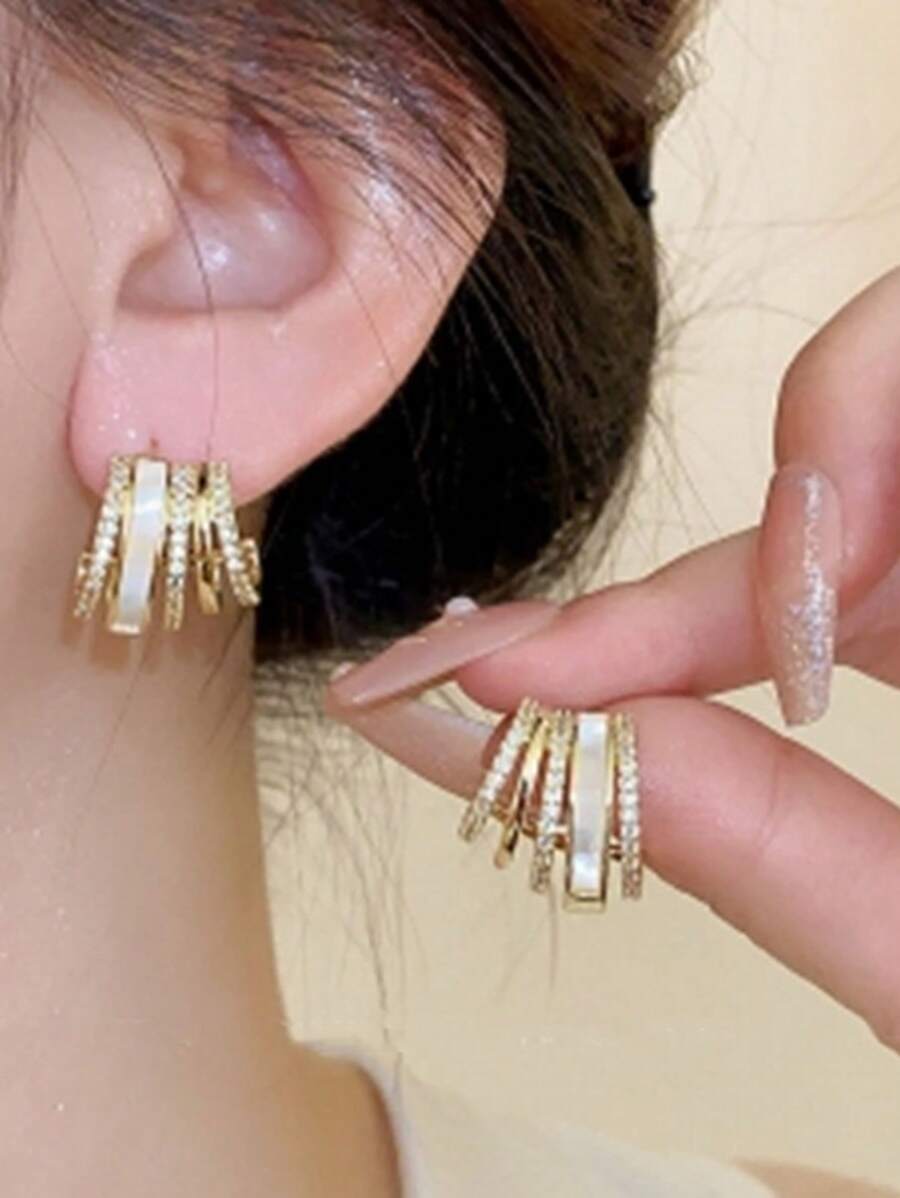 1 par de pendientes geométricos con forma de garra con diamantes microincustrados brillantes, pendientes elegantes para mujeres