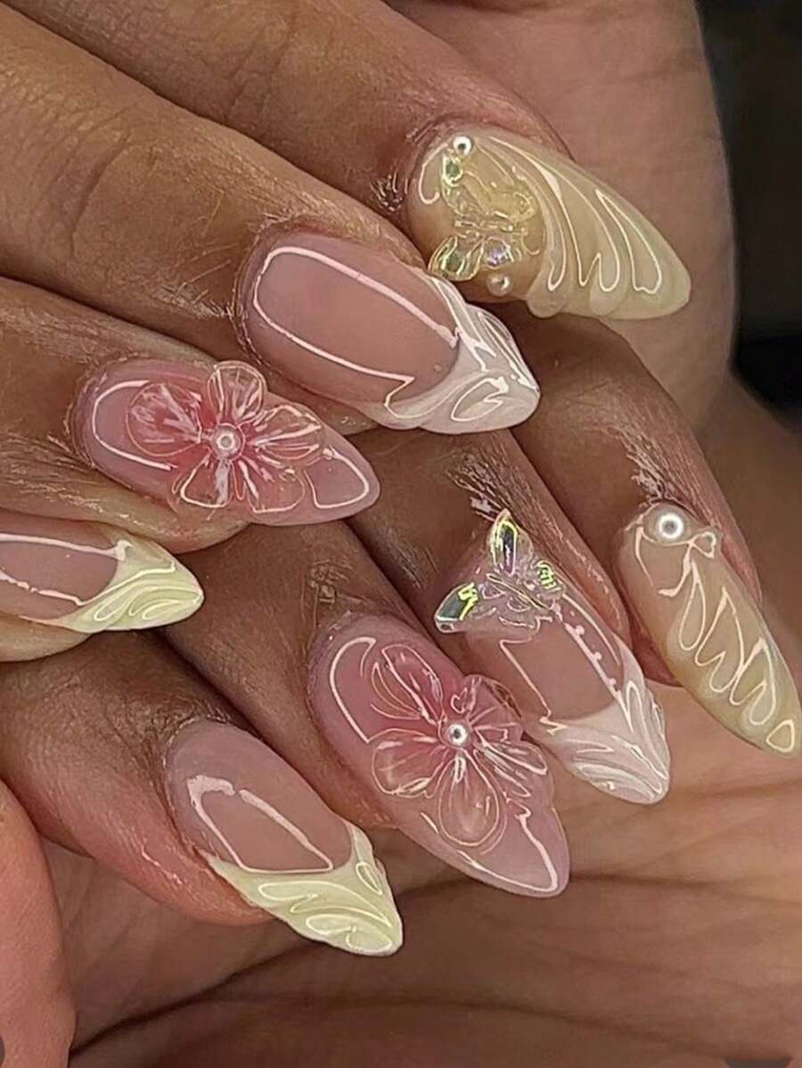 A Box Of 24 Medium Almond Nails, Light Yellow French Tips With 3D Pink Floral And Butterfly Accents, Showcasing A Fresh And Sweet Style, Press-On Nail Set With Nail File And Jelly Glue, Perfect For All Women, Ideal For Daily, Holiday, And Party Occasions, Adding A Touch Of Playful Elegance To Your Fingertips.