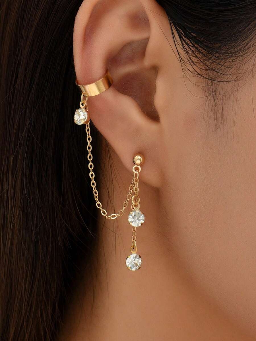 1 paire de boucles d'oreilles dorées style hip hop avec chaîne de strass à gland clip sur l'oreille