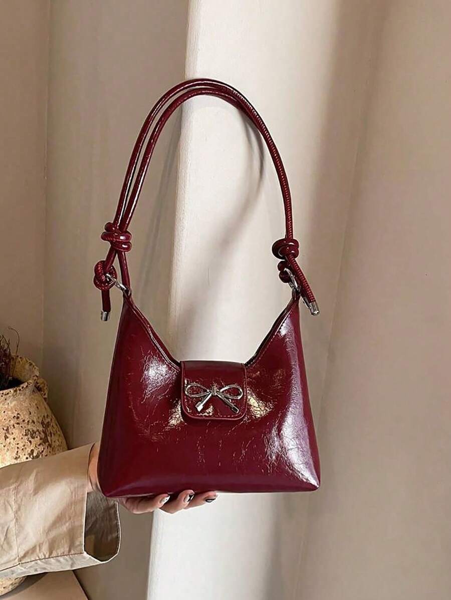 Bolso bandolera de mujer con decoración de lazo, de unicolor simple en PU, con forma de media luna. Un regalo de San Valentín perfecto