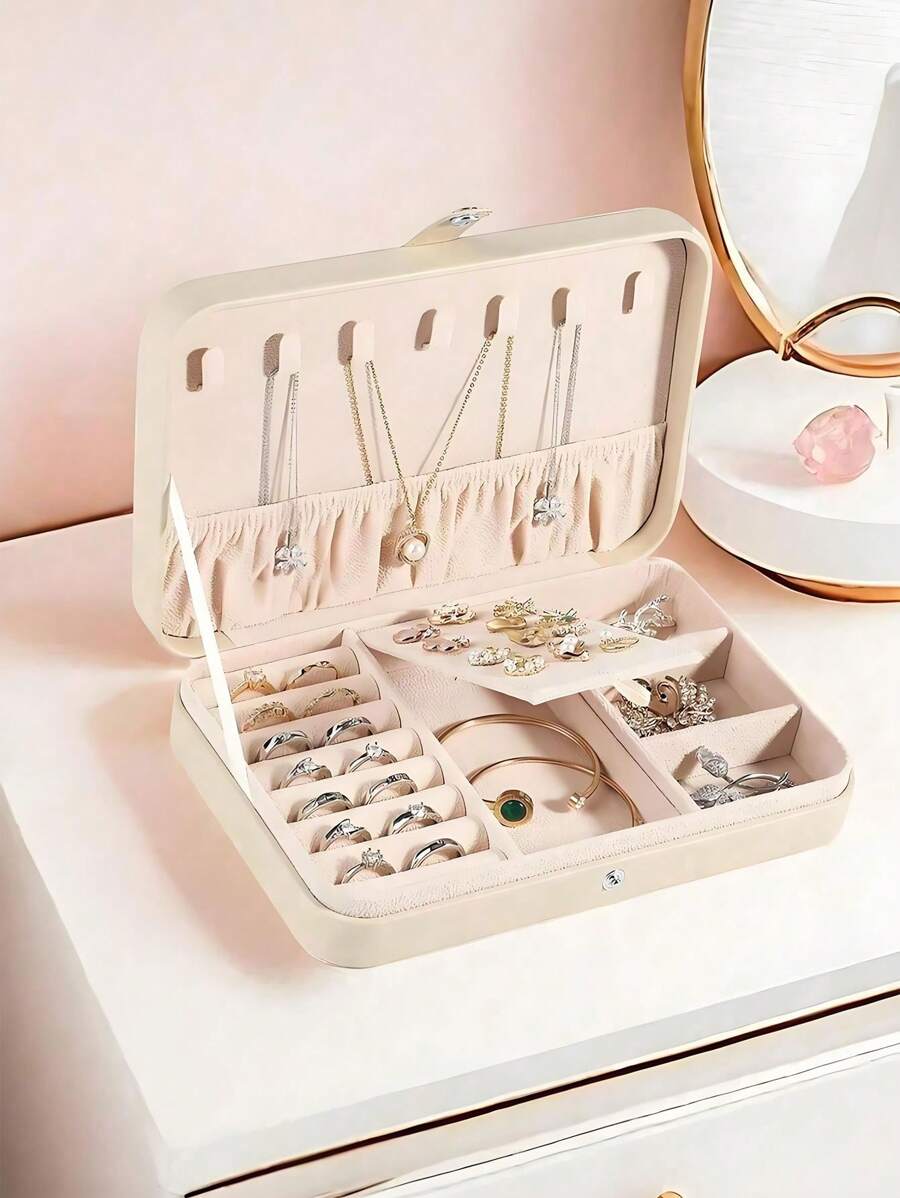 1 pieza Caja de almacenamiento de joyas de PU, organizador de joyas portátil de viaje, caja de almacenamiento de tocador, caja de exhibición de joyas de múltiples compartimentos, caja de regalo de almacenamiento, caja de exhibición, tapa abatible simple, gran capacidad, adecuado para guardar anillos, collares, aretes, relojes, labiales y otros accesorios, accesorios de dormitorio, suministros de viaje al aire libre, cierre con botón de seguridad, estilo internacional hermoso, adecuado para viajes y el hogar, regalo ideal para niñas