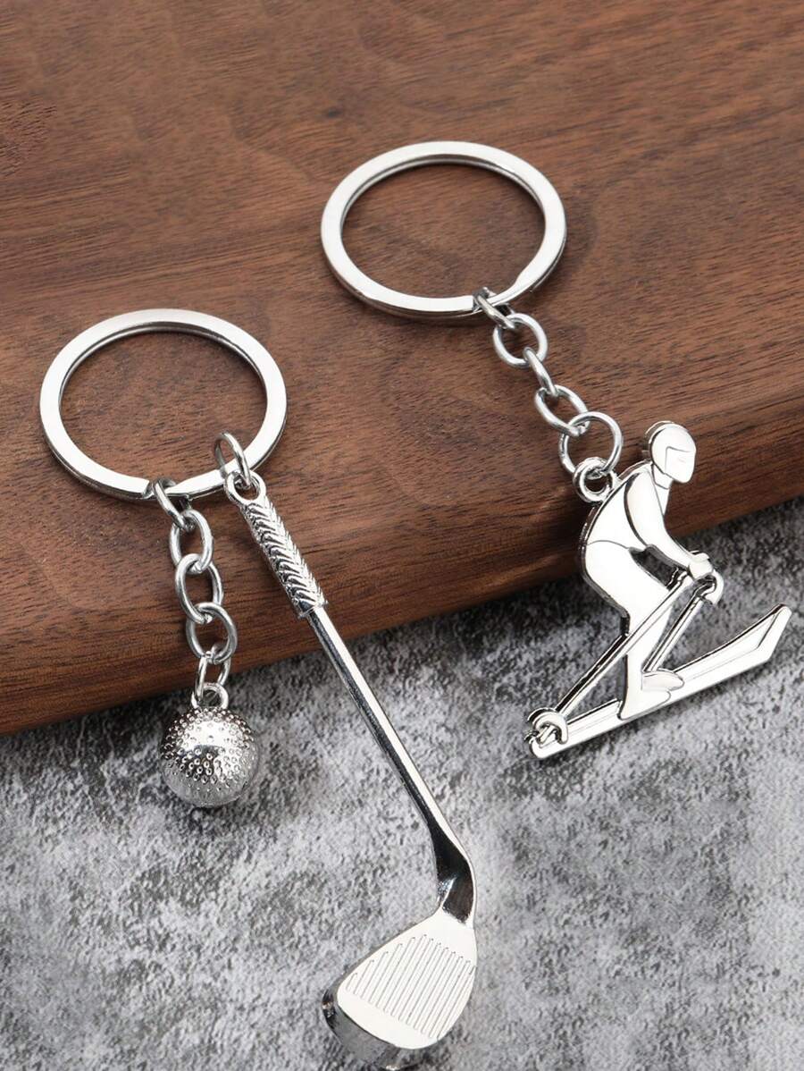 Colección creativa de llaveros con temas de deportes al aire libre: Bola de golf, Figura de esquiador, Timón de barco, Brújula, Balón de fútbol