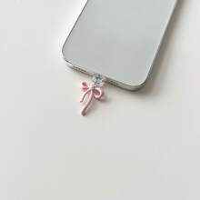 Tappo antipolvere con fiocco rosa