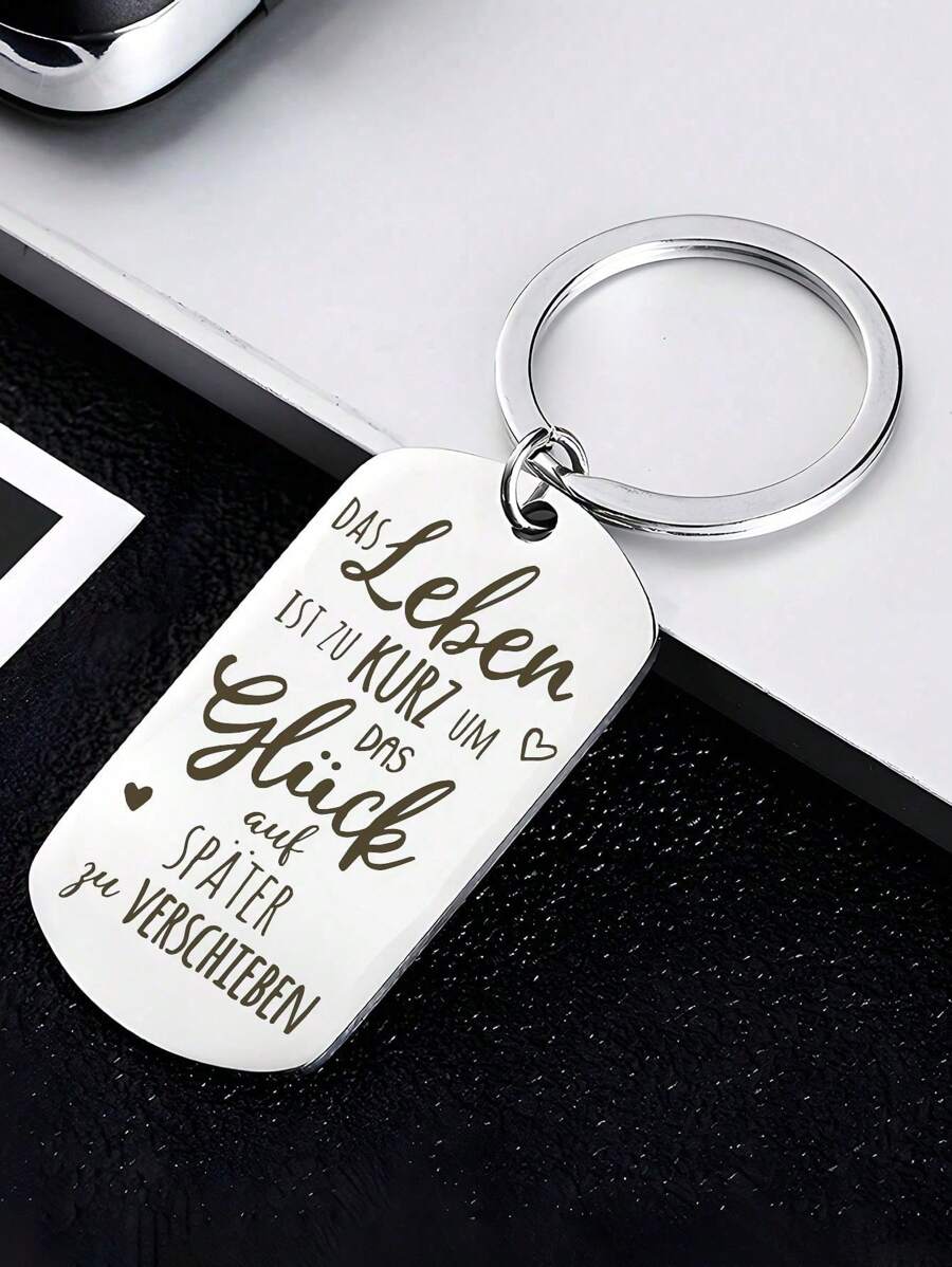 1 pieza Nueva Placa conmemorativa en acero inoxidable grabada con el lema inspirador alemán "La vida es corta, no retrases la felicidad", colgante de llavero, regalo para colegas y amigos