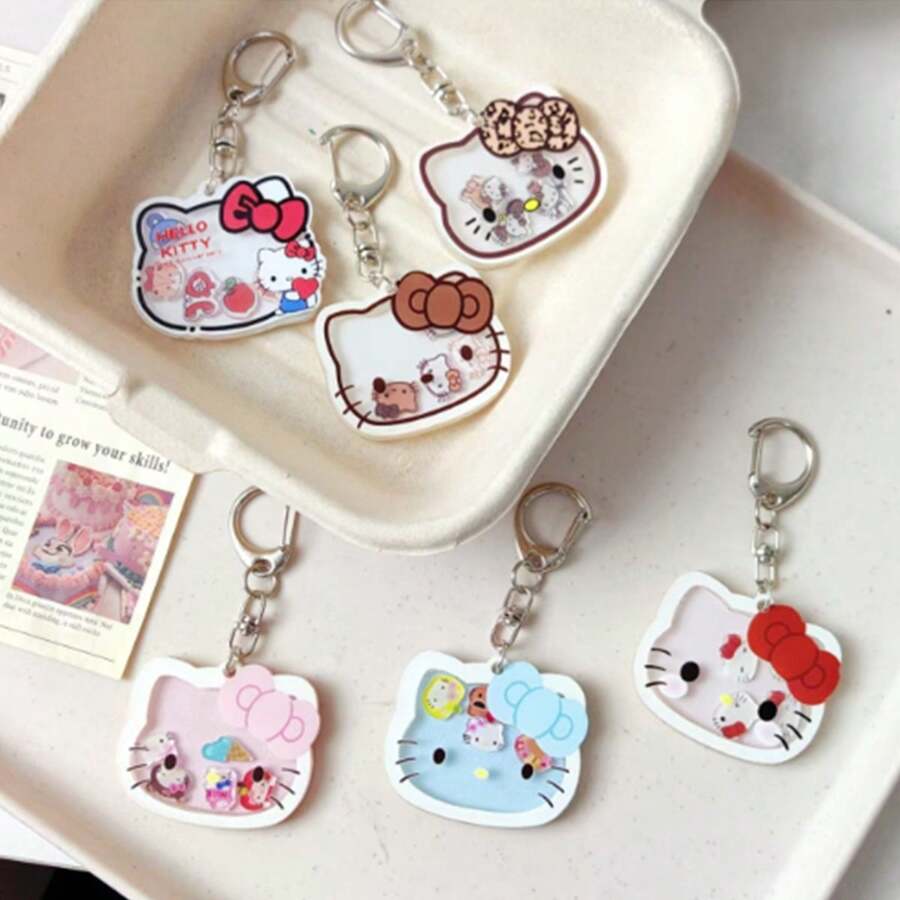 Sanrio 1 pieza Llavero con gatito de dibujos animados que se mueve, dije adorable de gato para mochilas y bolsos, regalo perfecto para cumpleaños, Pascua, accesorios adorables (estilo aleatorio)