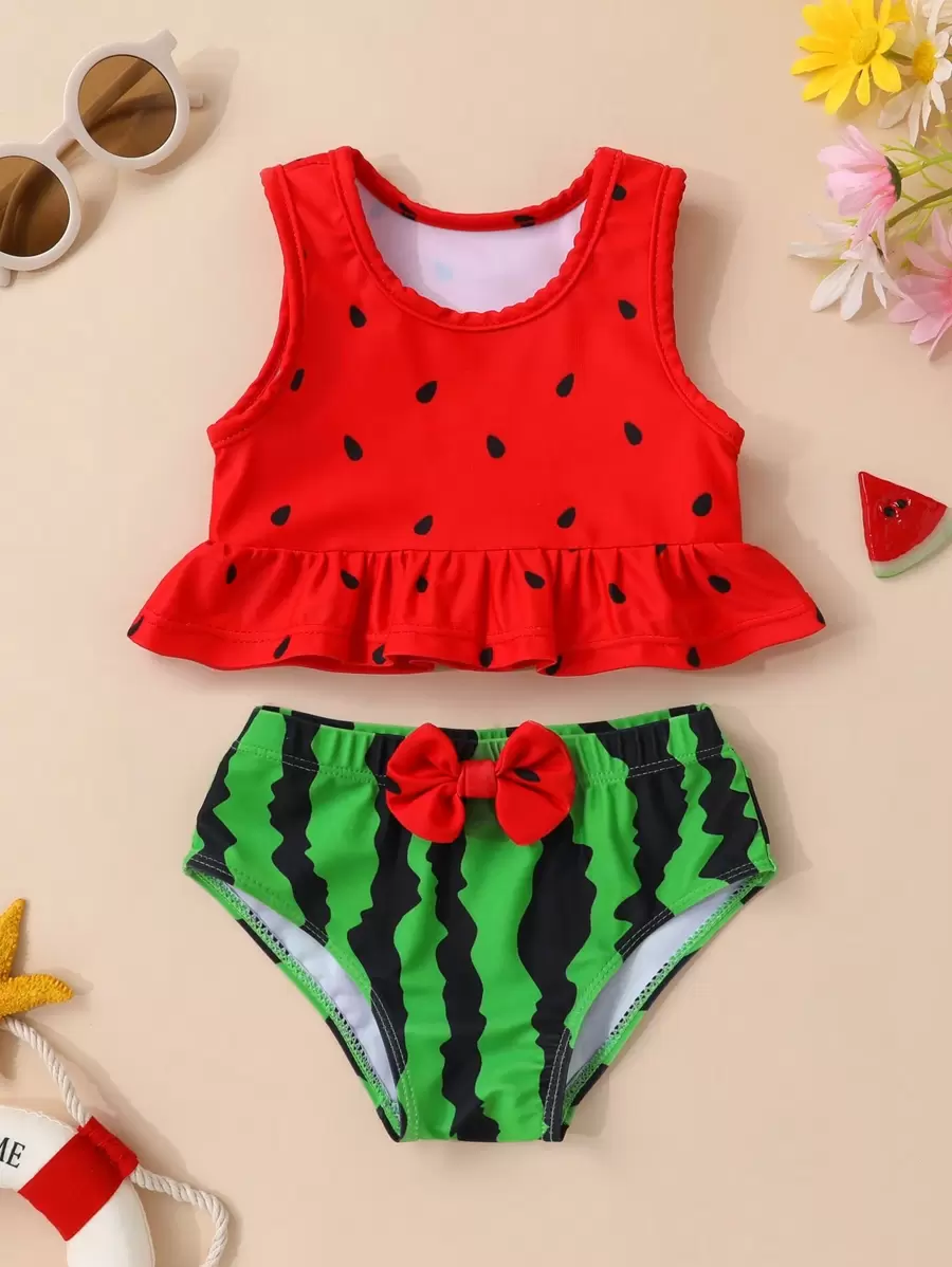 Conjunto de tankini y shorts para niña con estampado de sandía, volantes y lazo decorativo, ideal para el verano