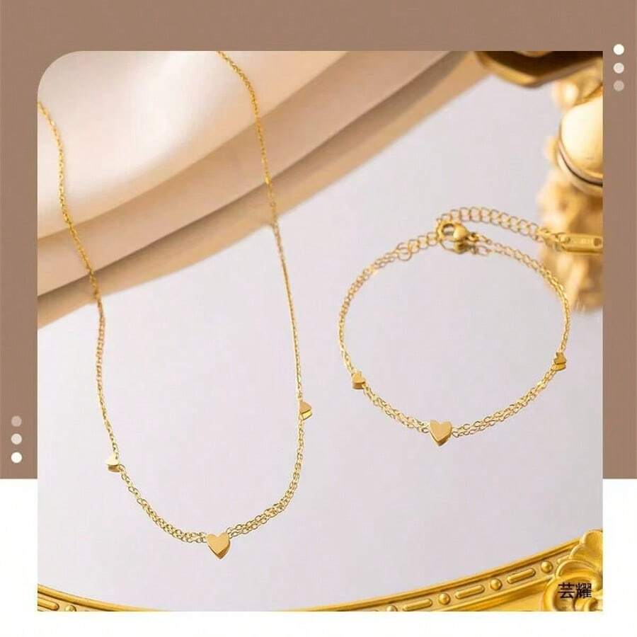 Conjunto de joyería de collar y pulsera con forma de corazón romántica, de acero de titanio en tono dorado, diseño único para mujer