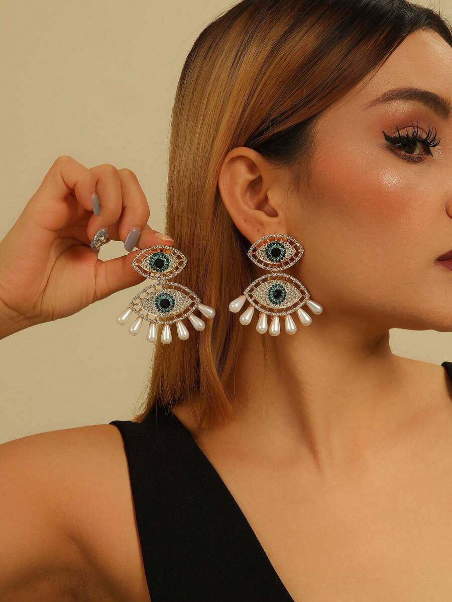 1 paire de boucles d'oreilles pour femme mode dramatique avec strass et faux perles en forme d'œil de diable, convient pour toutes les saisons, les soirées et le travail
