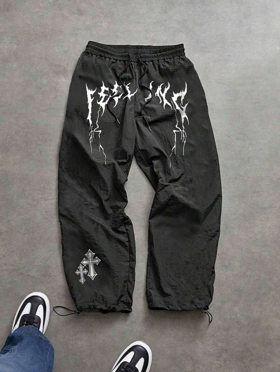 Manfinity Sport Corelite Pantalones deportivos casuales sueltos con cordón en la cintura y estampado de cruz para hombres