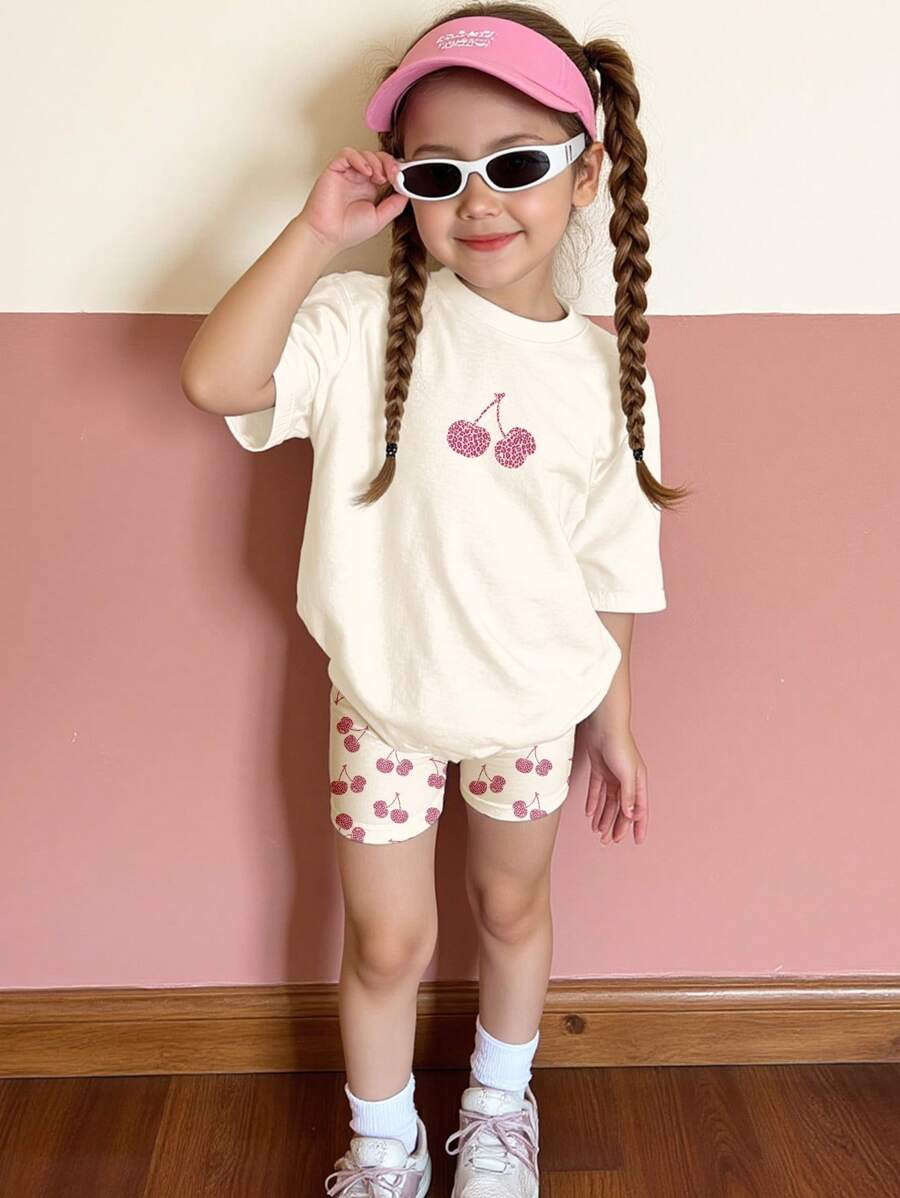 SHEIN Set de 2 piezas para niña con camiseta de manga corta con estampado de leopardo y cerezas y pantalón corto de ajuste holgado, adecuado para el verano