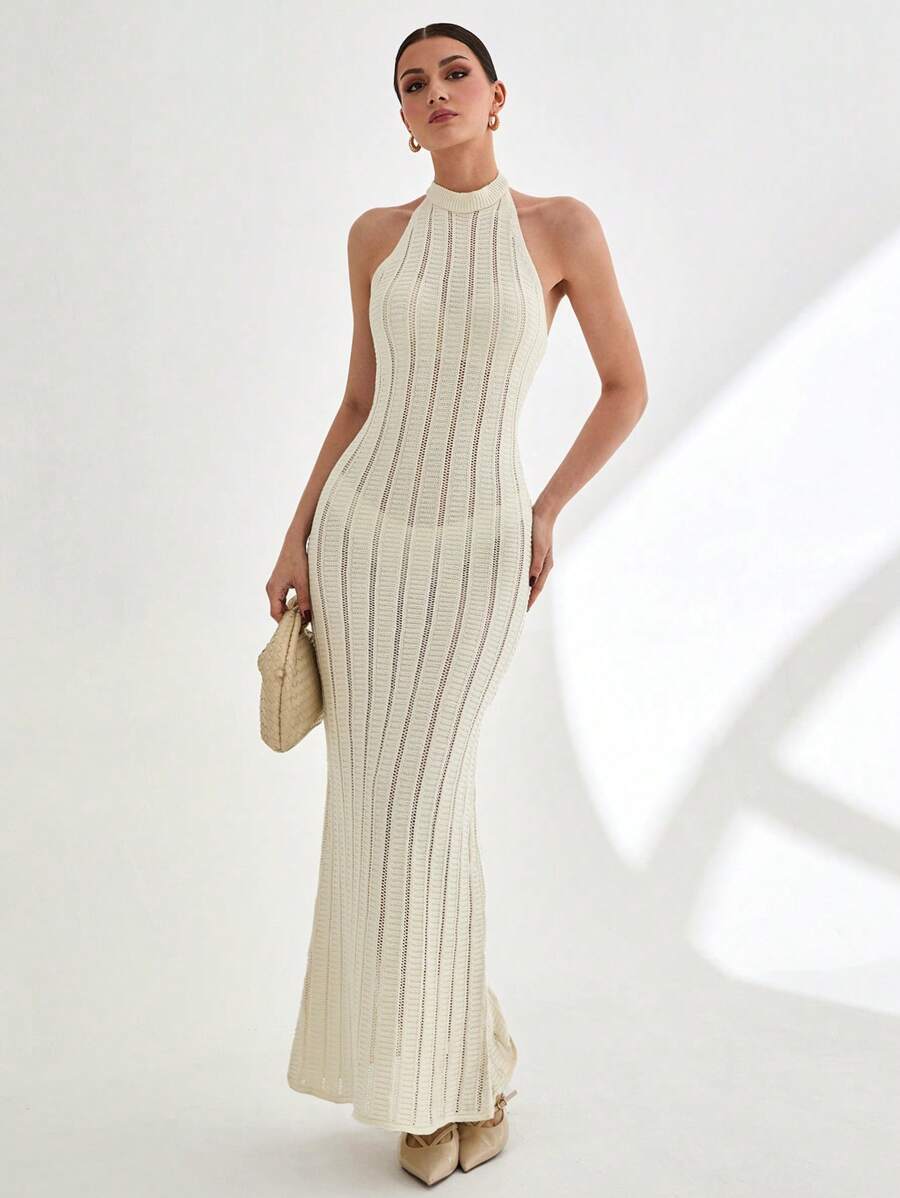 CLARA VERO Vestido largo de punto acanalado sin mangas con cuello alto y detalle de espalda abierta en color blanco