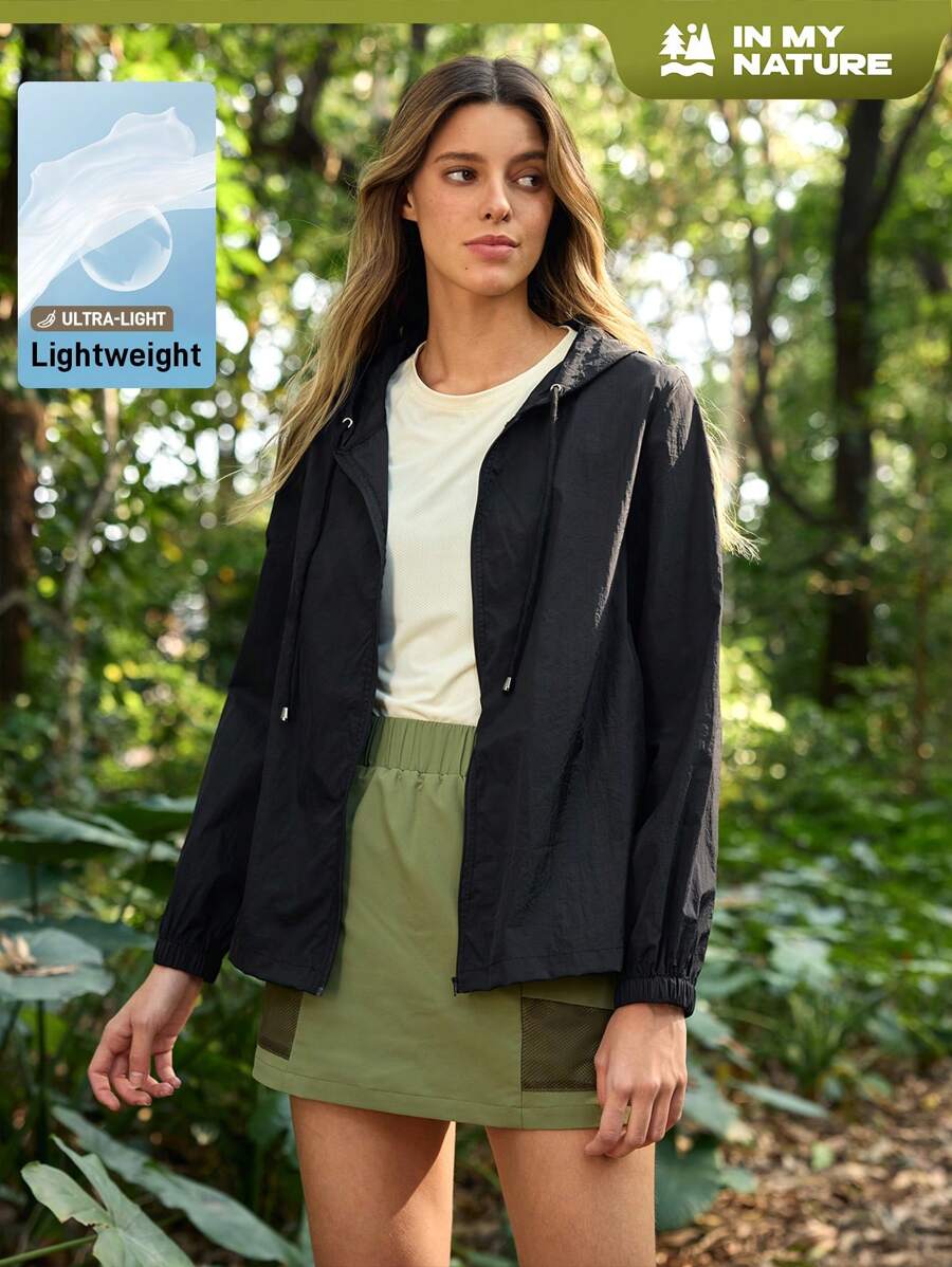 In My Nature Veste de soleil pour femmes avec col zippé, cordon de serrage, capuche et manches longues de couleur unie, idéal pour la randonnée