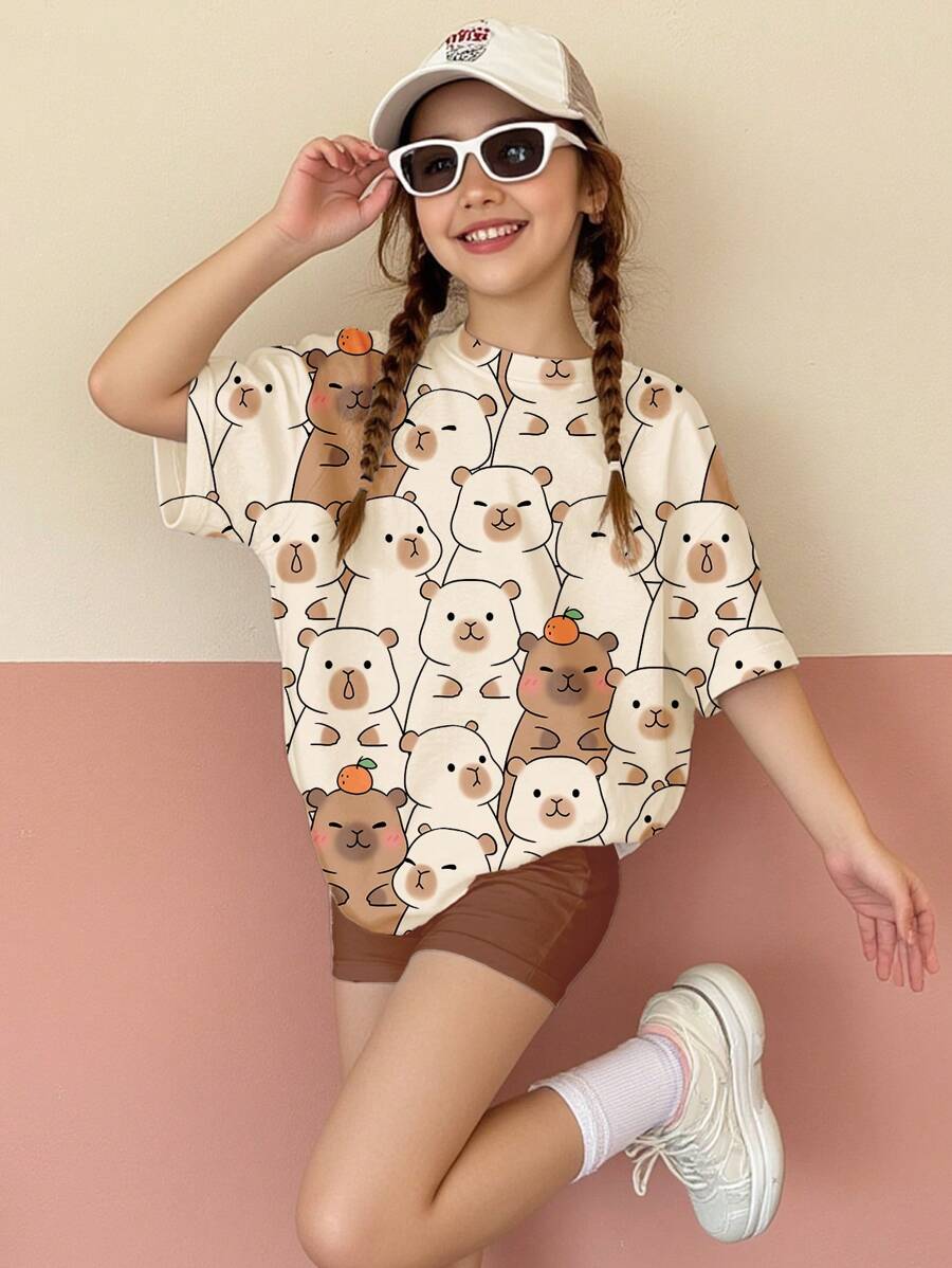 SHEIN Set de 2 piezas de camiseta de manga corta y pantalones cortos informales y holgados para niñas preadolescentes, con diseño lindo de carpincho, color meleagris, apropiado para el verano