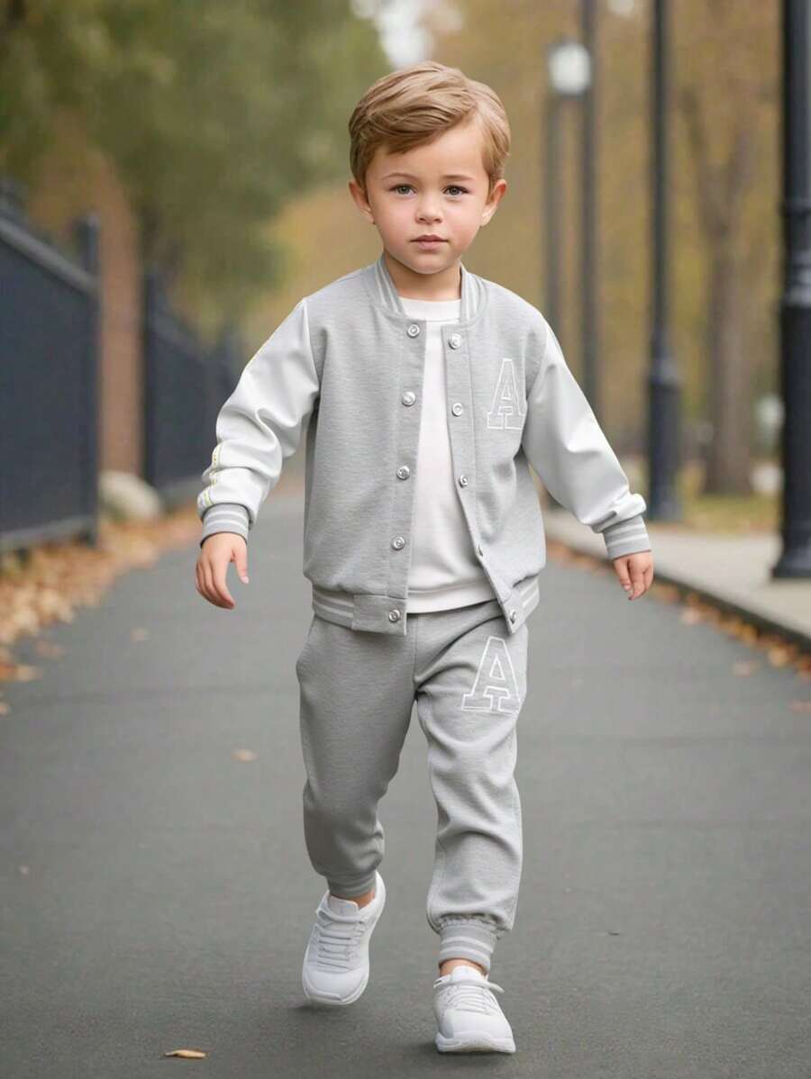 SHEIN Explorewe Conjunto de 2 piezas para niños pequeños - Suéter de punto negro con mangas blancas y estampado de letra "A" en el frente, combinado con pantalones de chándal a juego. Con cuello, puños y bajo acanalados para mayor comodidad. Casual, deportivo, adecuado para uso diario en primavera/otoño, escuela, viajes.