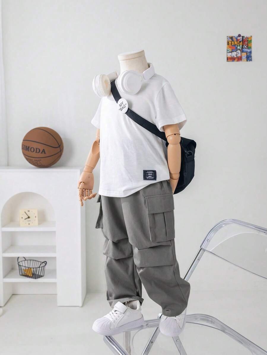 2pcs Tween Boy Casual Solid Color Round Neck Short Sleeve T-Shirt And Loose Woven Cargo Pants Set, Suitable For Commuting, School, Everyday Casual, Travel, Sports, Spring, Summer, Autumn, Winter