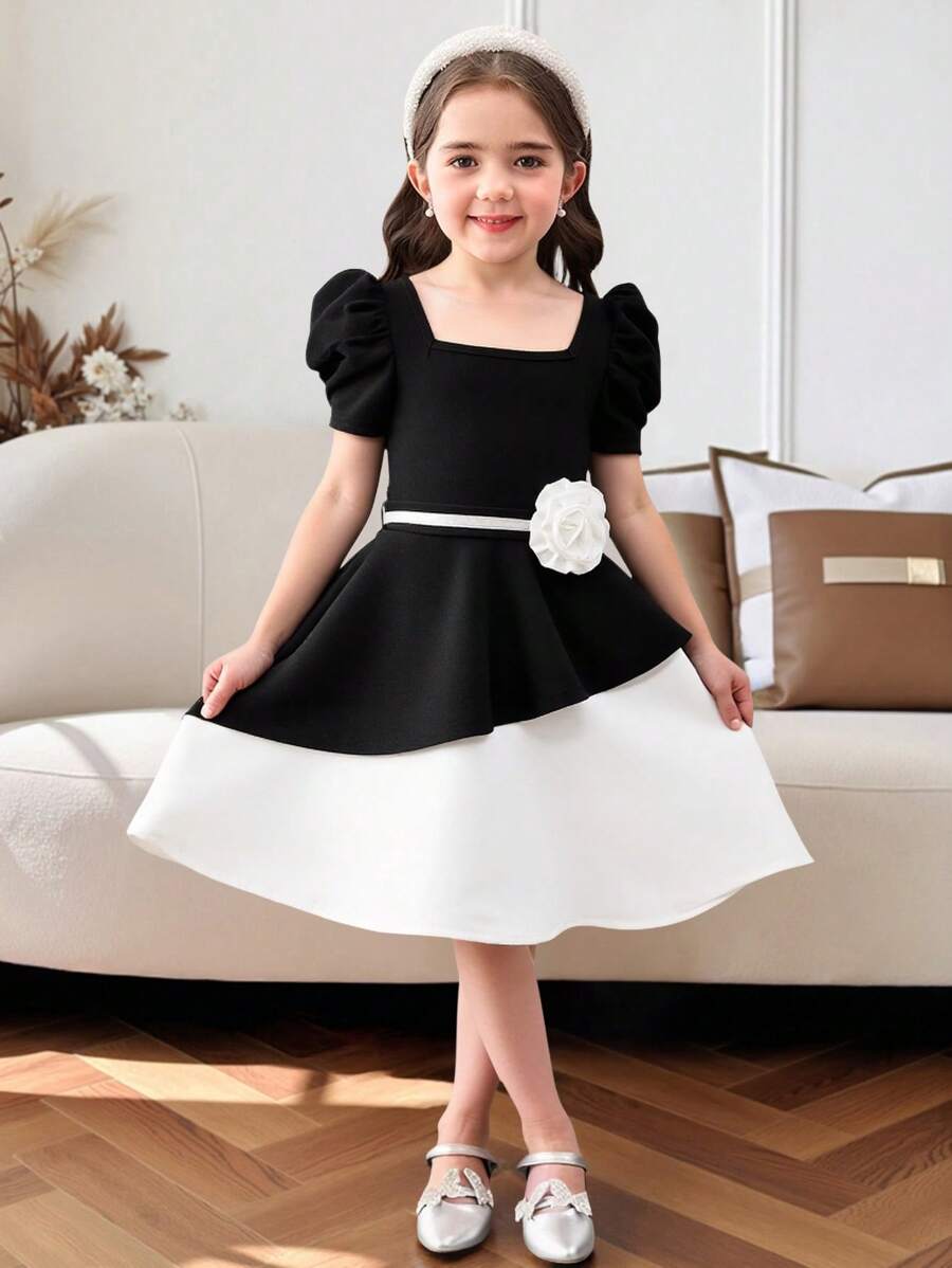 Vestido midi de niña con mangas abullonadas, bloque de color blanco y negro, bajo asimétrico y decoración de flores 3D. Adecuado para uso diario, reuniones familiares y ocasiones especiales