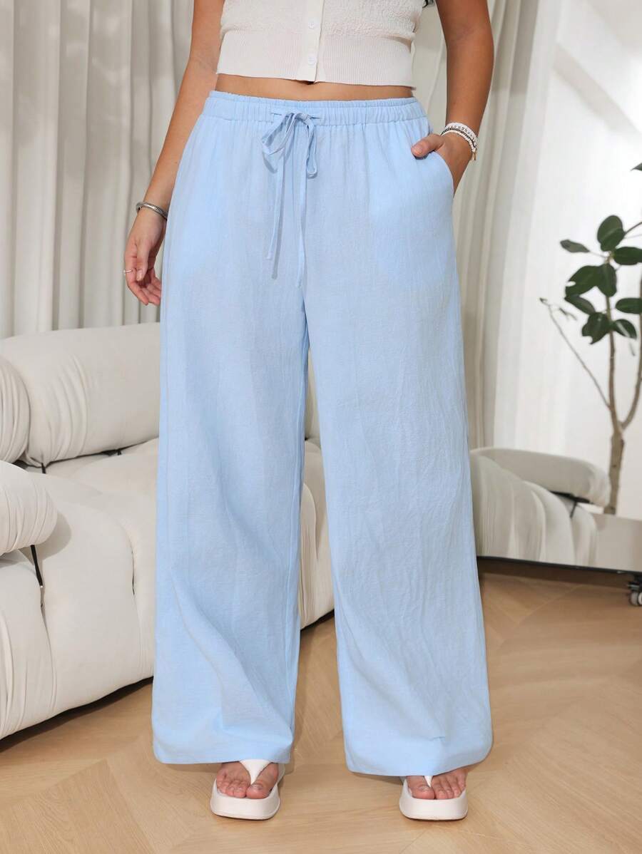SHEIN EZwear Pantalones casuales sueltos de pernera ancha con cinturón en color liso para mujer de talla grande