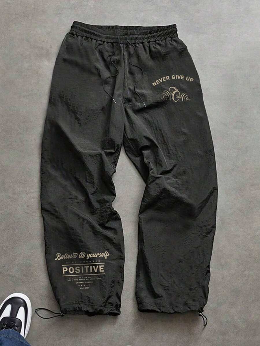 Manfinity Sport Corelite Pantalones deportivos de hombre con estampado de eslogan y dobladillo con cordón