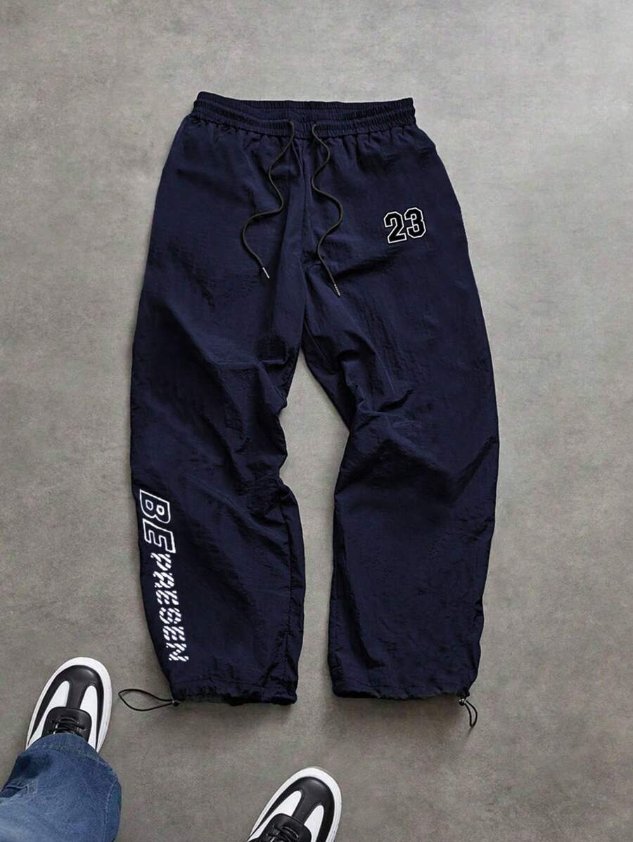 Manfinity Sport Corelite Pantaloni casual sportivi da uomo con stampa a lettera, vita con coulisse, comodi e larghi, abbigliamento sportivo da allenamento, pantaloni da jogging, pantaloni da palestra, pantaloni della tuta, pantaloni sportivi, abbigliamento da palestra ampio e traspirante autunnale