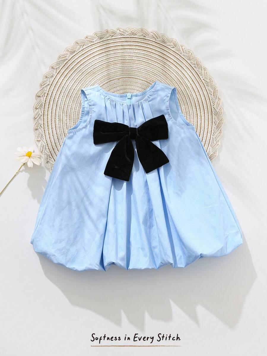 Cozy Pixies Robe décontractée et polyvalente pour bébé fille nouveau-né avec col rond et sans manches, décorée d'un nœud