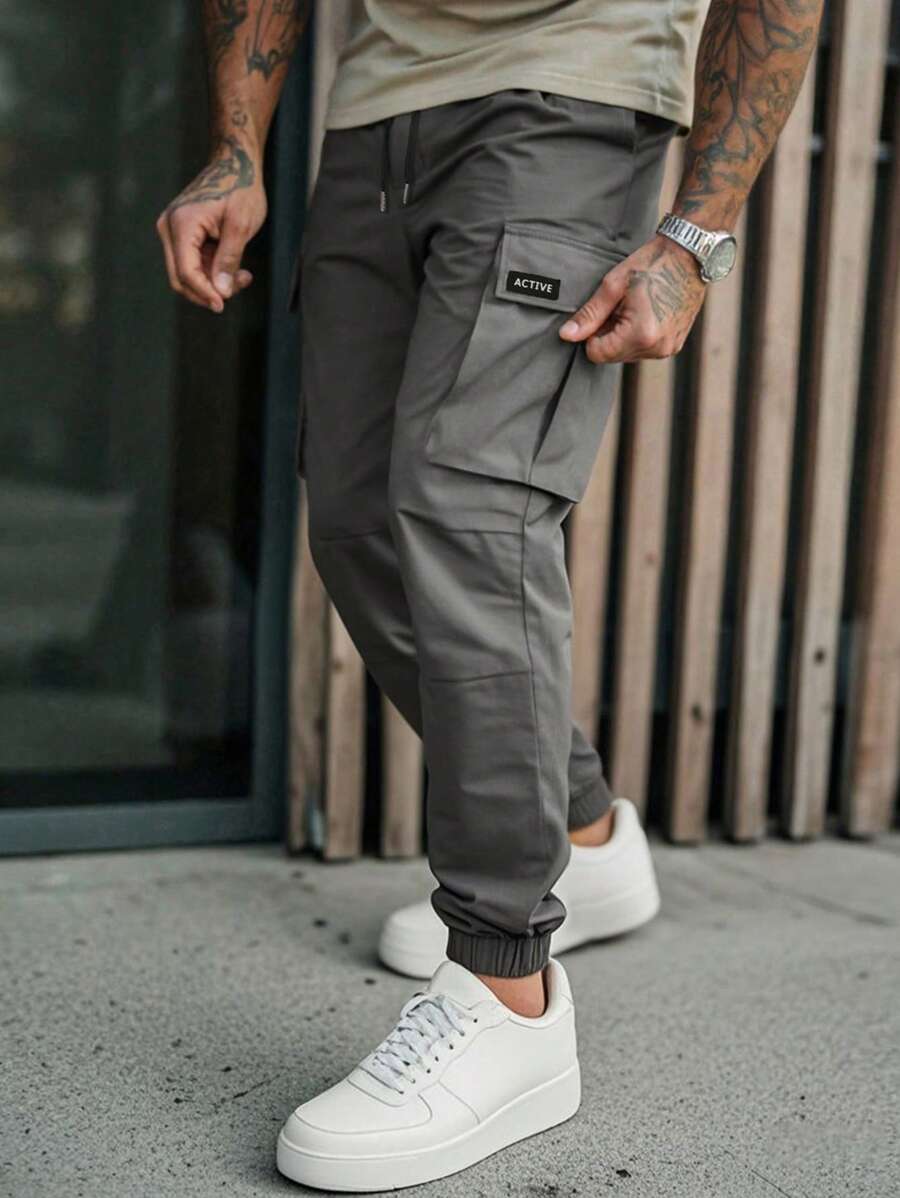 Manfinity LEGND Pantalones casuales de carga con cintura elástica para hombre, pantalones tipo cargo jogger de estilo carga para hombres