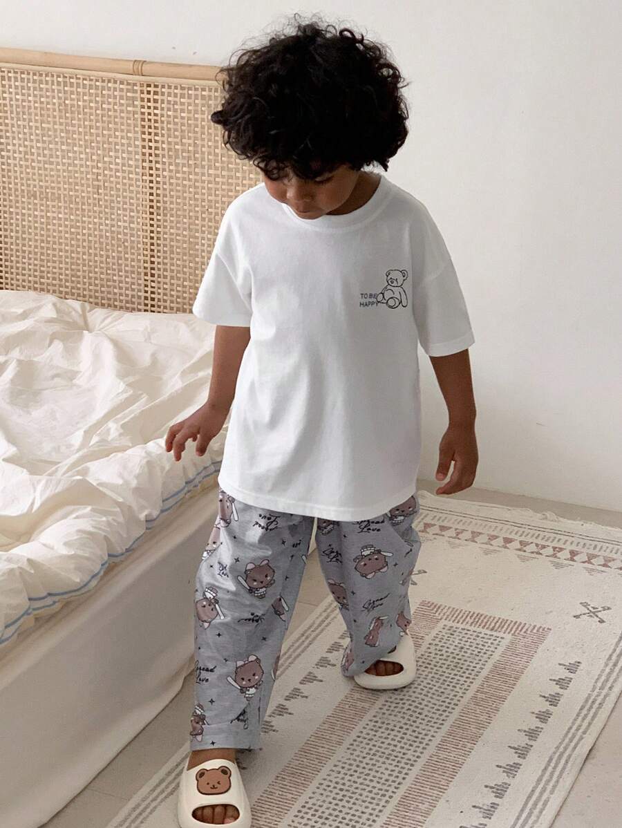 DAZY Young Boy Cartoon Bear & Letter Print Drop Shoulder Loose T-Shirt And Wide Leg Loose Pants Pajama Set, Summer