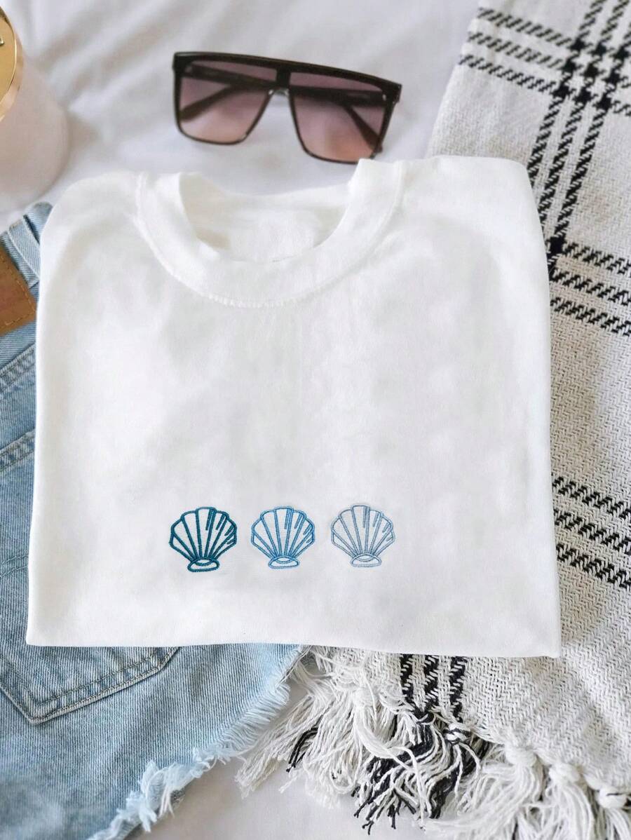 INAWLY T-shirt décontracté à manches courtes et col rond avec imprimé de coquillages pour femme, parfait pour l'été