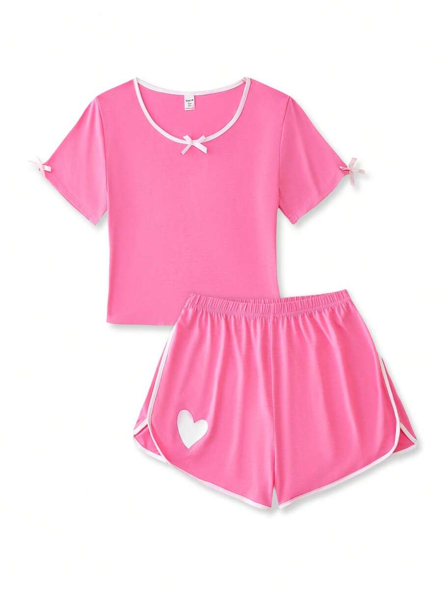 Conjunto de 2 piezas para adolescentes: Camiseta de cuello redondo de manga corta con decoración de lazo para niños y conjunto de pijama corto con estampado de corazón para niñas