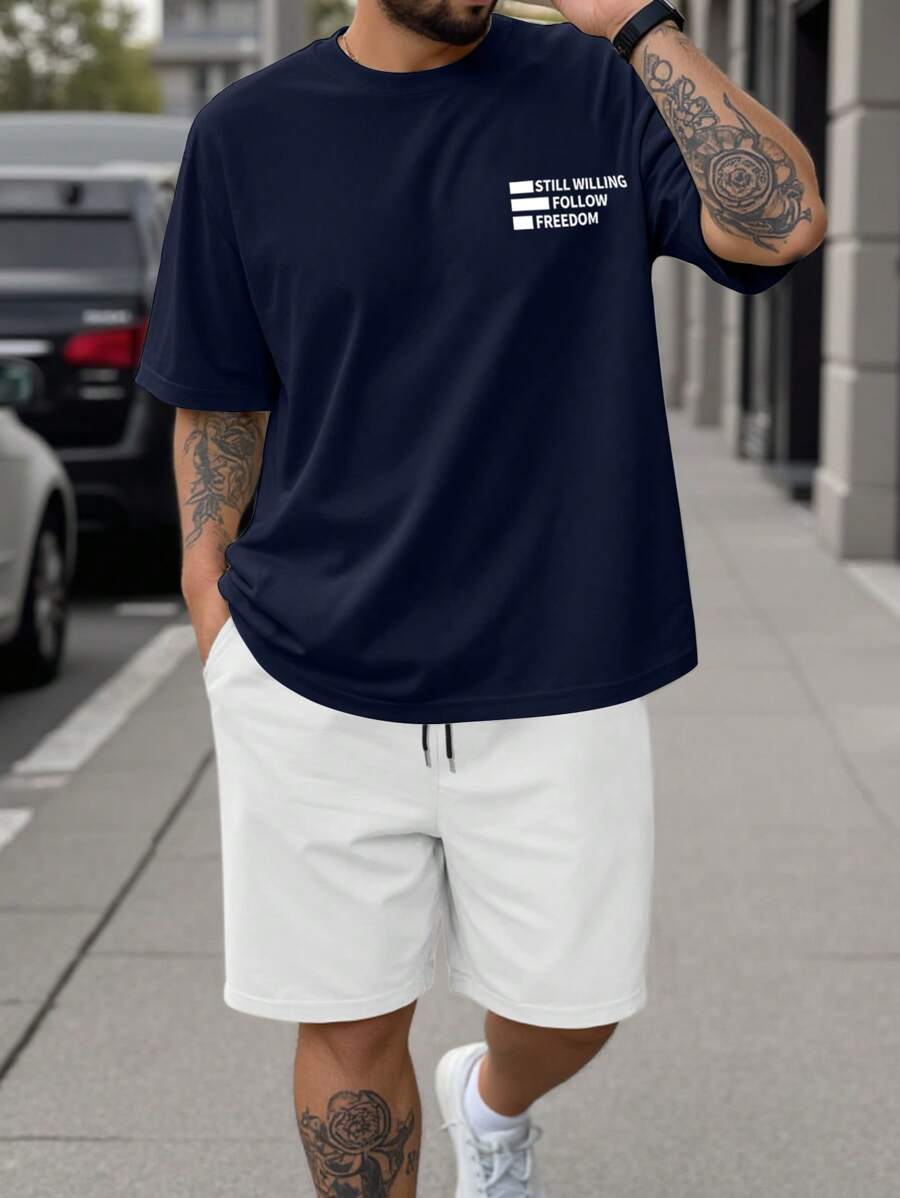 Manfinity Homme Men's Casual Outfit Including Navy Blue Short Sleeve T-Shirt With "Still Willing To Follow Freedom" Graphic Print, Paired With White Sports Shorts. Fashionable And Elegant, Also Makes A Great Gift For Boyfriend. Men's Shorts Set, Plus Size Men's 2-Piece Outfit, Travel Set.