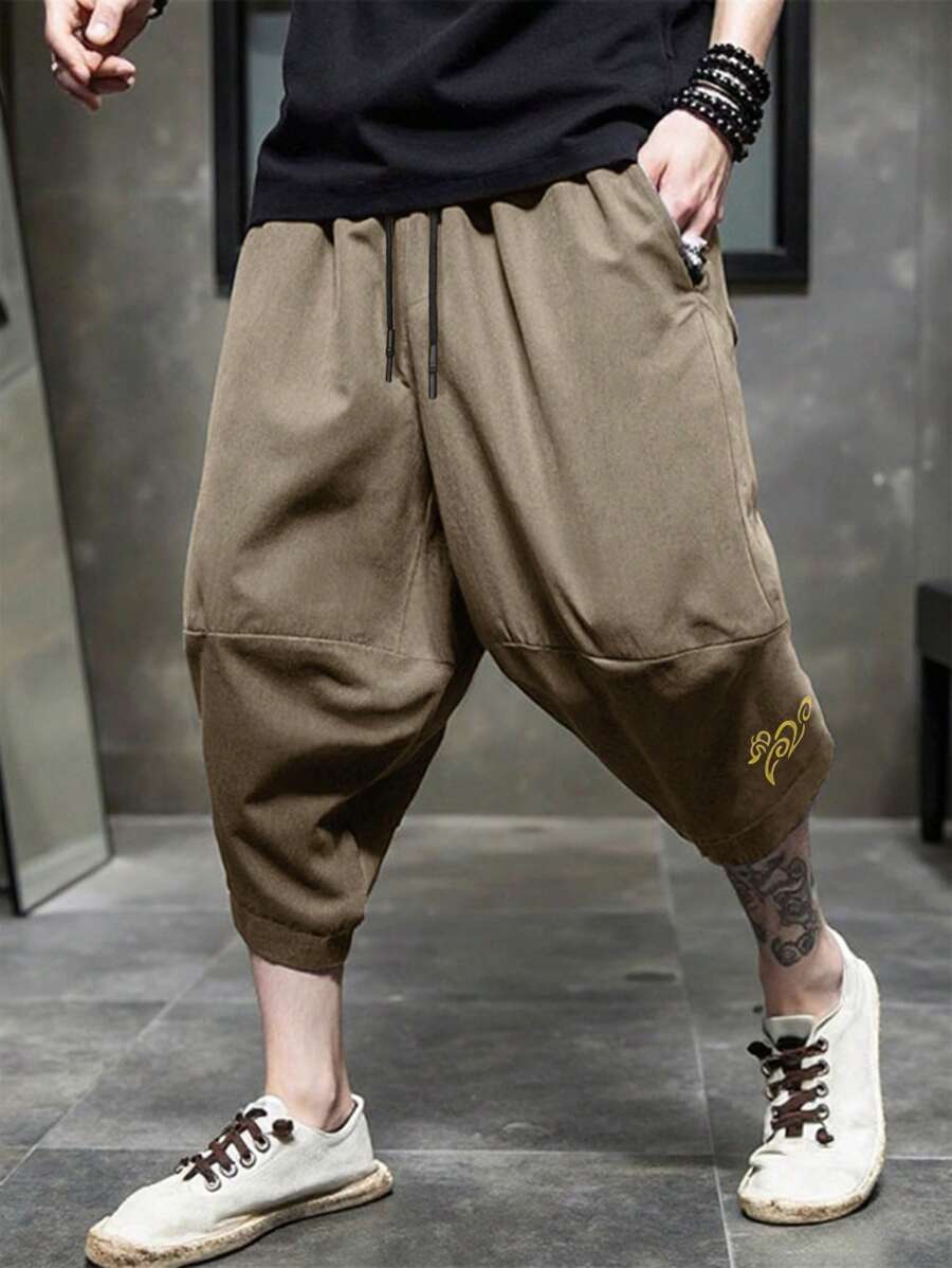 Manfinity Homme Pantalones cortos holgados tipo capri y estilo casual con estampado nacional para hombres