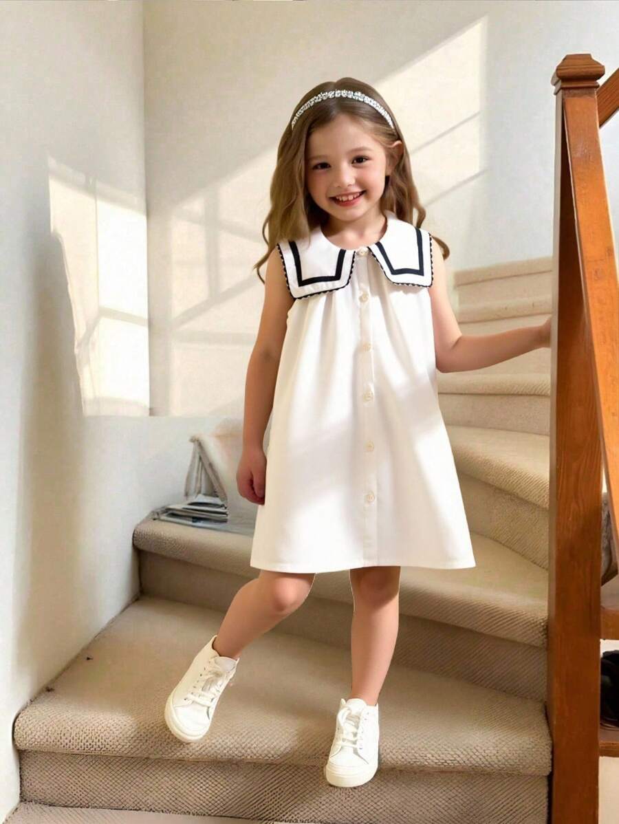 Vestido de niña con cuello marinero, sin mangas, con botones y detalle de cinta, en estilo fresco y casual para verano. Vestido blanco con estilo marinero para niñas, vestido uniforme para niñas