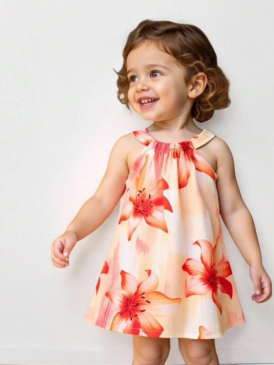 SHEIN Playful Pals Robe-camisole à col ras-du-cou imprimée de fleurs pour bébés filles. Les nouveaux produits pour le printemps, l'automne et l'été sont maintenant sur le marché. Elle est confortable, stylée, mignonne, douce, élégante, décontractée et convient aux vacances. C'est une pièce indispensable pour le port quotidien.