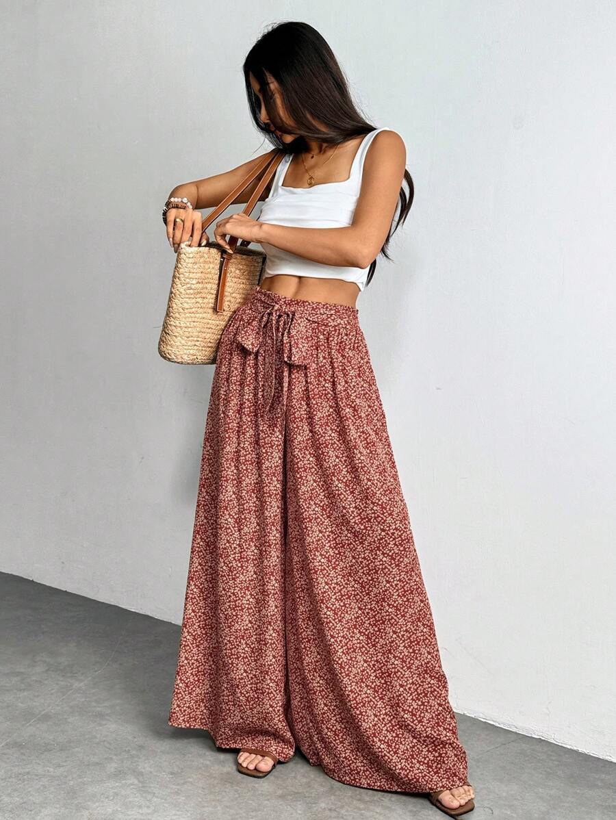 SHEIN PETITE Pantalones de pierna ancha para vacaciones con bolsillos y lazo frontal con estampado floral menudo para mujer