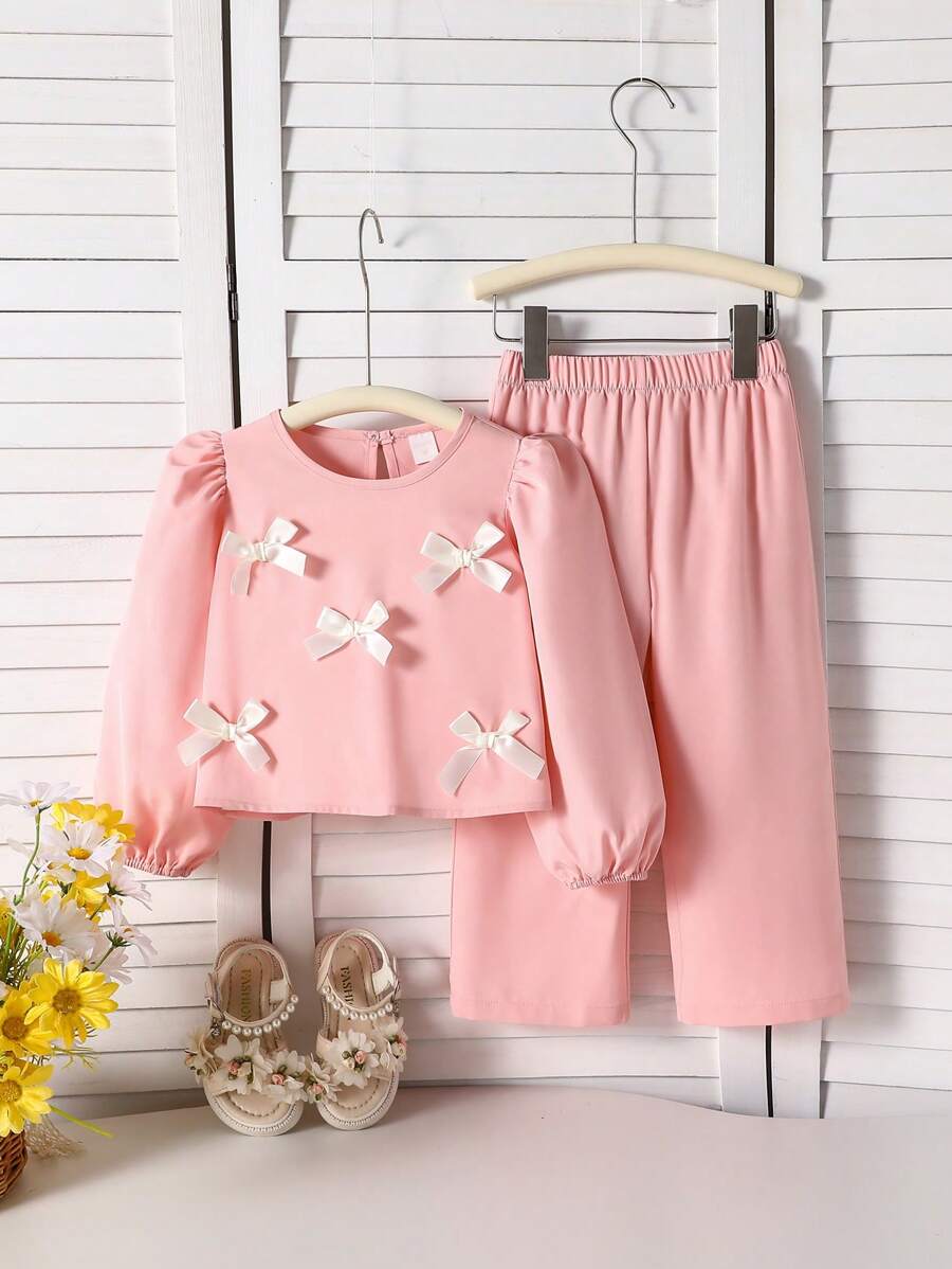 Conjunto de 2 piezas de parte superior de manga larga y pantalones para niña, parte superior rosa con manga abullonada y decoración de moño blanco, traje casual de alta gama cómodo para salidas, reuniones y uso diario