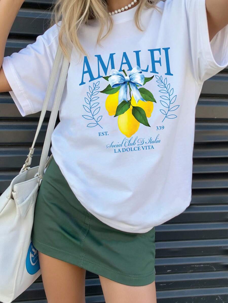 Camiseta básica de manga corta con estampado de letra en forma de limón, decorada con lema casual, rama y lazo para niñas