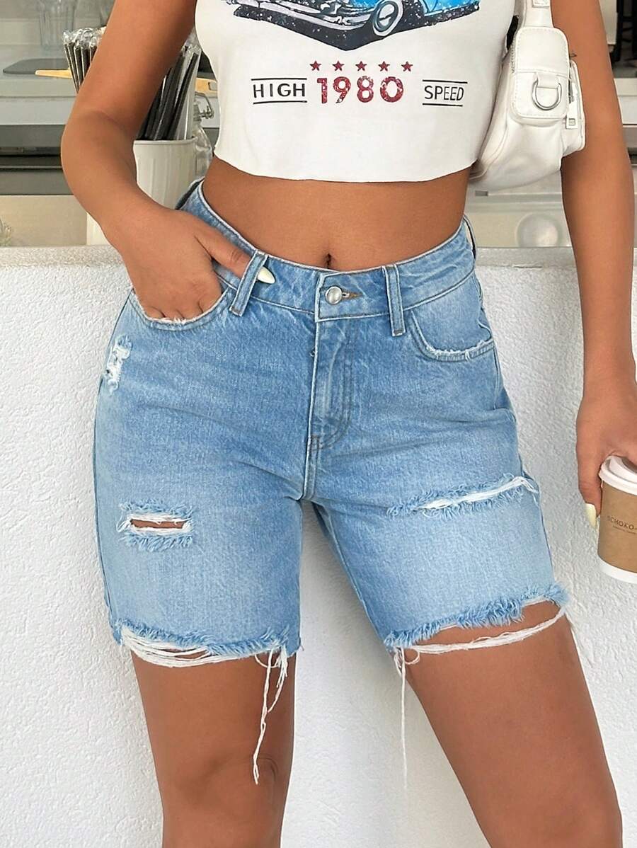 SHEIN Shorts de mezclilla con lavado desgarrado, de talle bajo y bolsillos sesgados