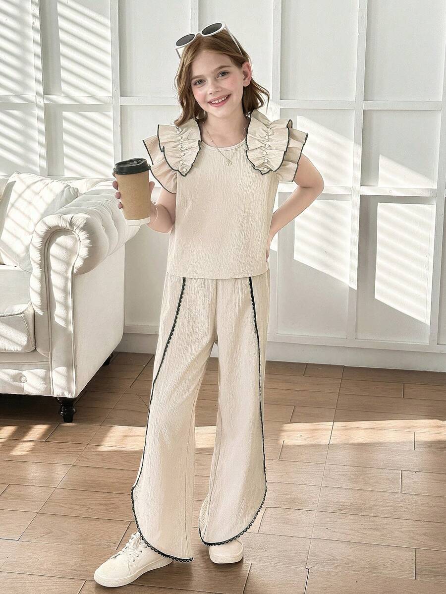 Set de 2 piezas para niñas con top de punto de color albaricoque con volantes y decoración de perlas, y pantalones 3/4 con bajo asimétrico. Elegante vestimenta diaria y de resort para el verano