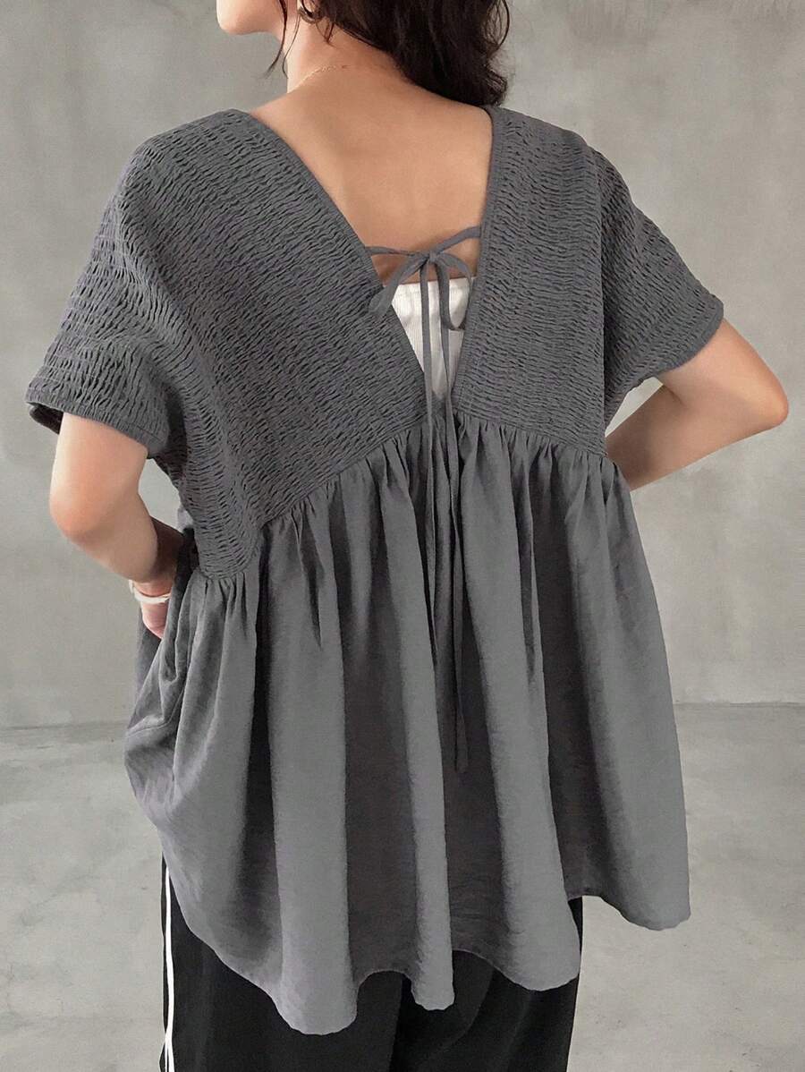 FRIFUL T-shirt ample et décontracté pour femmes, de couleur unie avec un patch au dos, nœud papillon et découpe. Idéal pour l'été.