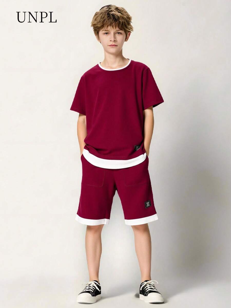 SHEIN Conjunto de ropa casual de verano para niños preadolescentes que incluye una camiseta de manga corta con bloques de color y ribetes contrastantes, y shorts con bolsillos
