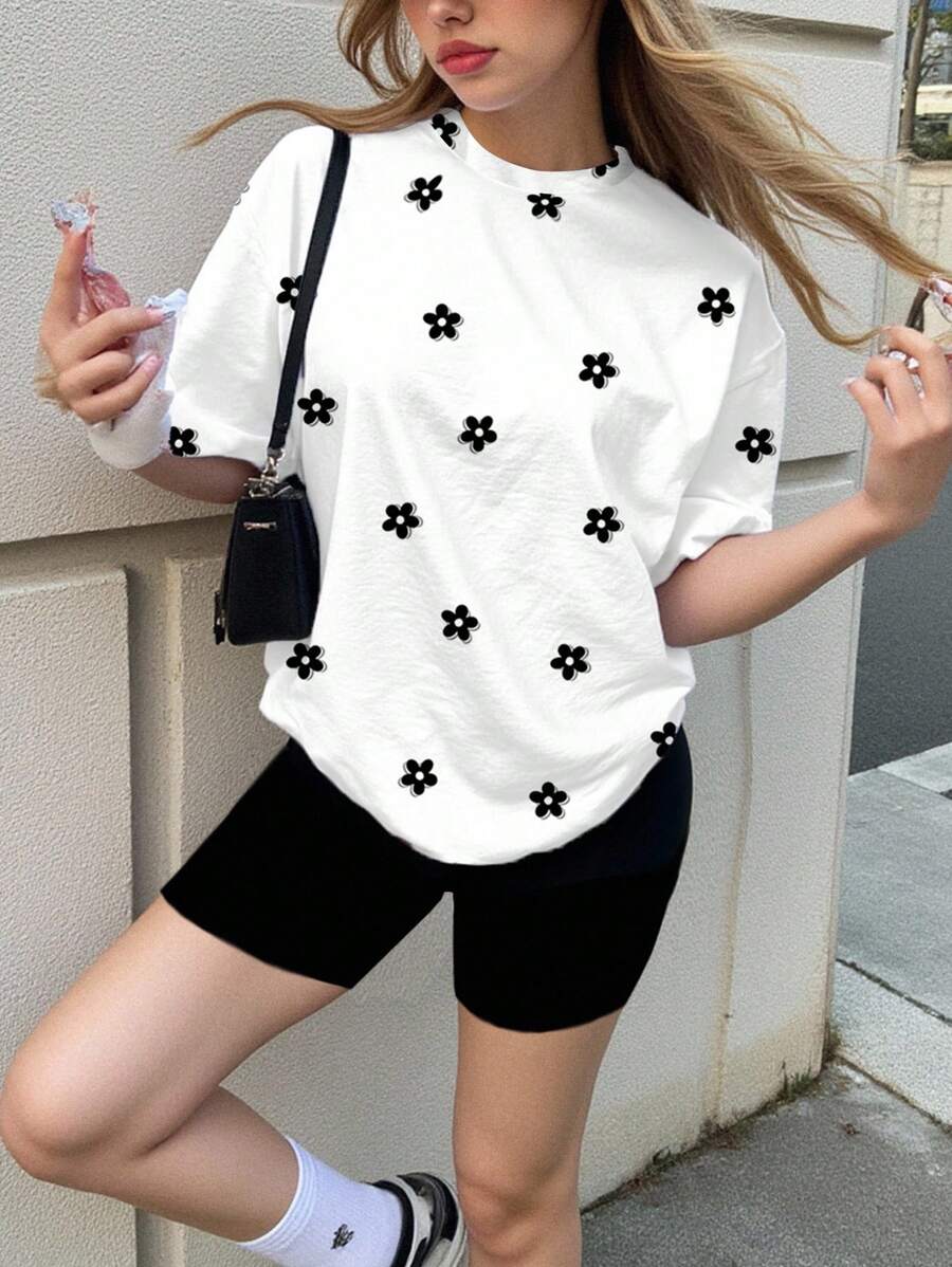 SHEIN Conjunto de 2 piezas para adolescentes con camiseta holgada de manga corta y estampado floral minimalista en blanco y negro, y leggings, apropiado para el verano