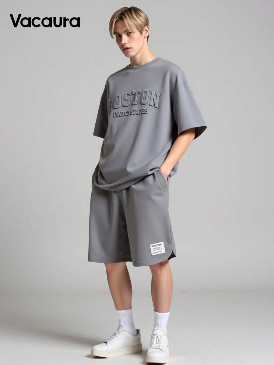 2 piezas Conjunto casual para adolescentes varones, camiseta tipo jersey con estampado en inglés de acero en relieve y diseño de cuello redondo, talla grande shorts con diseño minimalista texturizado y pierna curva, adecuado para verano y otoño