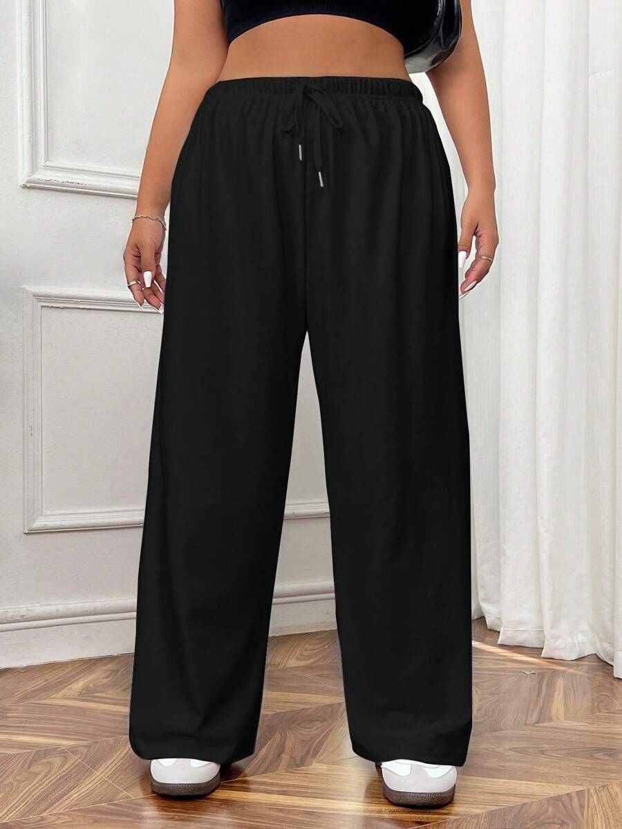 Calça de moletom plus size com amarração frontal e cor sólida simples e casual