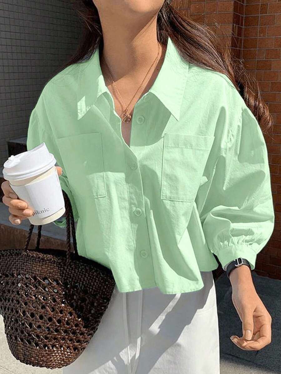 Jouncy Camisa suelta de manga corta de un solo pecho con bolsillo de unicolor para mujer