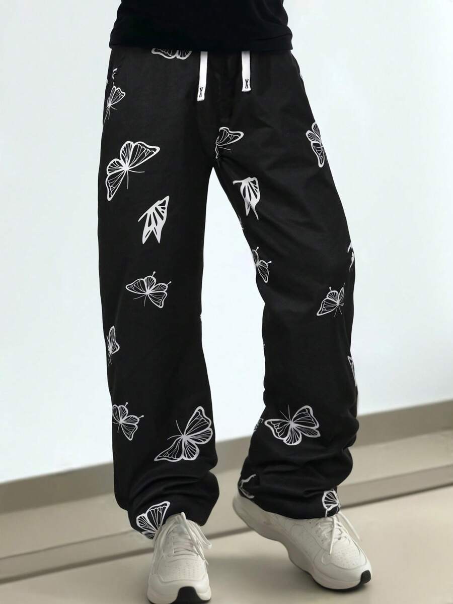 Yemwry Men's Casual Pants With Butterfly Pattern Detail, Simple Design For Daily Wear. Unique Butterfly Print Casual Pants, Classic Black & White Colorway, Casual Drawstring Design. Suitable For Strolling The Streets Or Casual Gatherings, To Showcase Your Distinctive Charm.