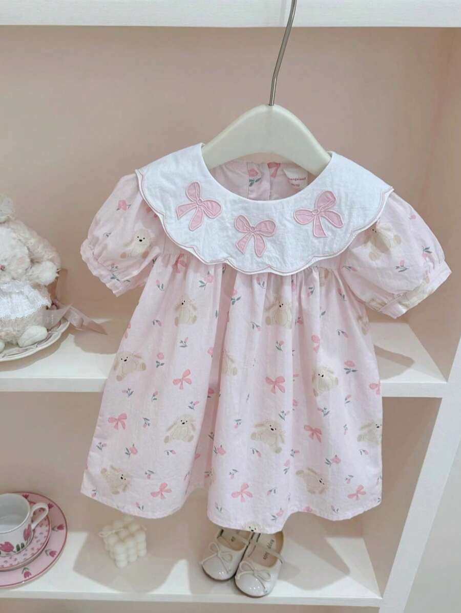 Vestido elegante para meninas com gola redonda bordada e laço, estampa de coelho e floral, estilo moderno, adequado para atividades ao ar livre, festivais, festas, primavera/verão