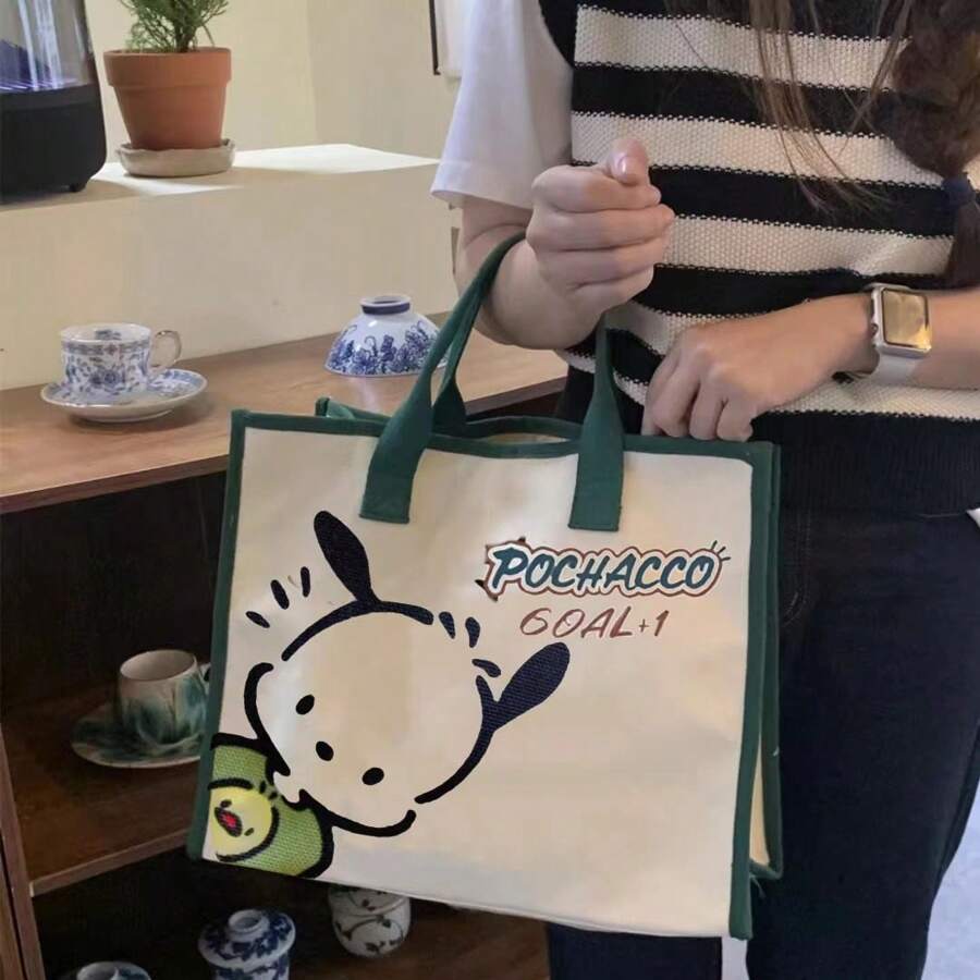 Sanrio Sac fourre-tout en canevas Pompompurin de Sanrio - Sac à bandoulière mignon et spacieux pour femmes, cabas solide pour les livres avec une sangle réglable pour l'école/l'université/les trajets | Fournitures scolaires essentielles kawaii, rentrée scolaire