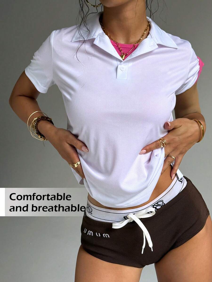 Polo de moda para mujer con diseño de malla texturizada transpirable y elástica, de estilo minimalista casual para uso diario