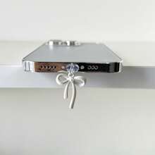 Tappo antipolvere con fiocco bianco