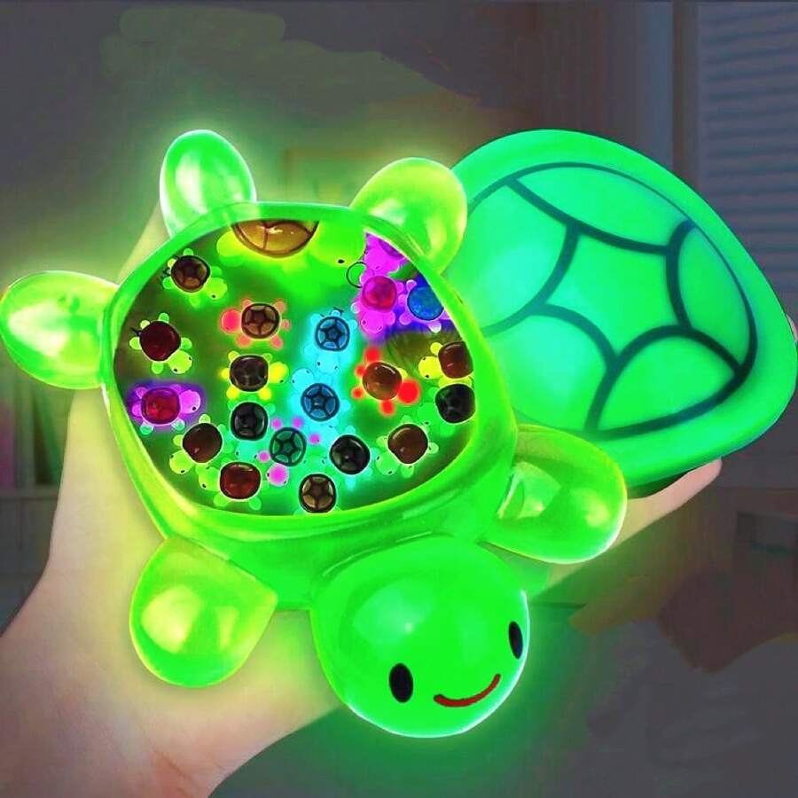 Jucărie decorativă luminoasă colorată în formă de broască țestoasă gigantică (trebuie să absoarbă lumina ultravioletă) care poate fi folosită ca ornament pentru casă - poate fi plasată pe birouri, pervazuri etc. și poate fi folosită și pentru decorarea petrecerilor, creând o atmosferă veselă. Este un cadou excelent pentru pasionații de broaște țestoase și cadouri de ziua de naștere (carapacele broaștelor țestoase nu sunt strălucitoare).