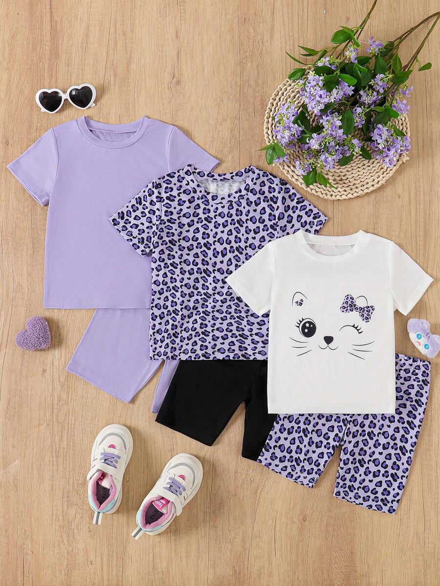 Set de 3 conjuntos de niñas con top de manga corta de cuello redondo y shorts, uno con estampado de gato de dibujos animados y otro con estampado de leopardo liso